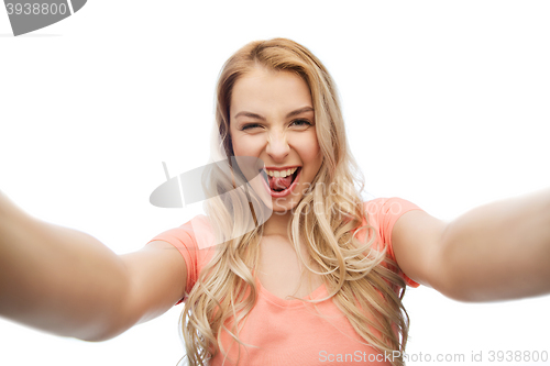 Image of happy smiling young woman taking selfie