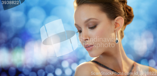 Image of beautiful young asian woman with earring