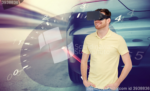 Image of man in virtual reality headset and car racing game