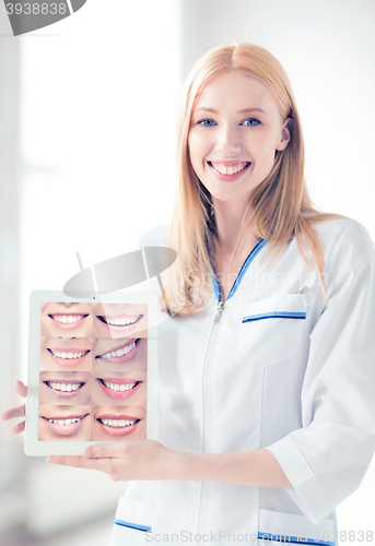 Image of female doctor with tablet pc and smiles