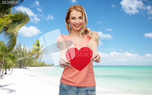 Image of happy woman or teen girl with red heart shape