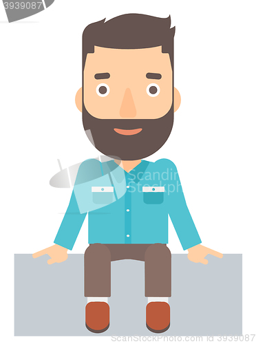 Image of Smiling man sitting.