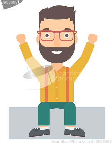 Image of Man sitting with raised hands up.