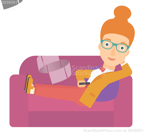 Image of Woman sitting on the couch with remote control.