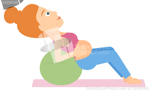 Image of Pregnant woman on gymnastic ball.