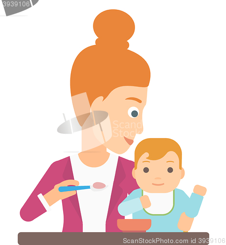 Image of Woman feeding baby.