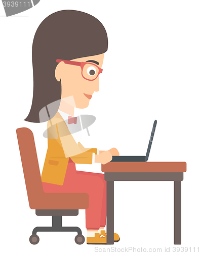 Image of Woman working at laptop.