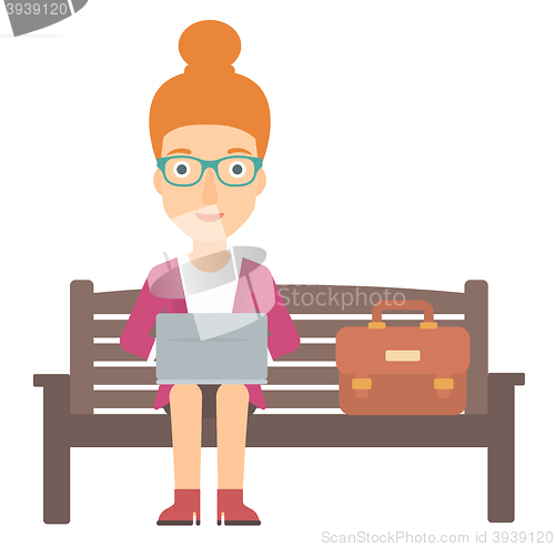 Image of Woman working on laptop.