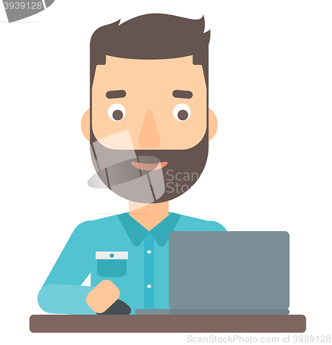 Image of Man working at laptop.