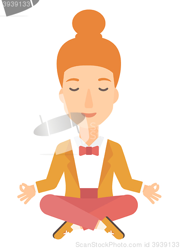 Image of Business woman meditating in lotus pose.