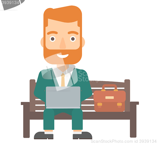 Image of Man working on laptop.