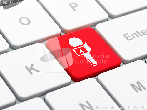 Image of News concept: Microphone on computer keyboard background