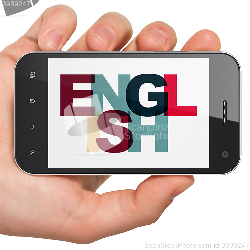 Image of Learning concept: Hand Holding Smartphone with English on  display