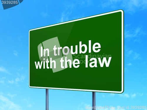Image of Law concept: In trouble With The law on road sign background