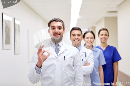 Image of group of happy medics or doctors at hospital