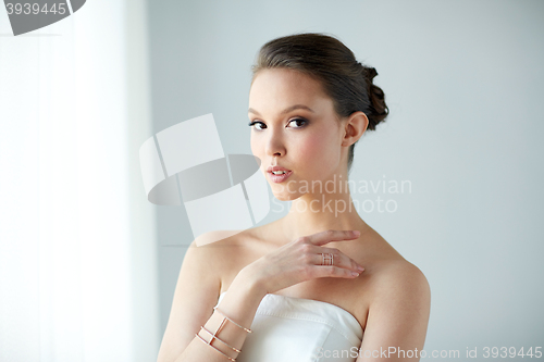 Image of beautiful asian woman with ring and bracelet