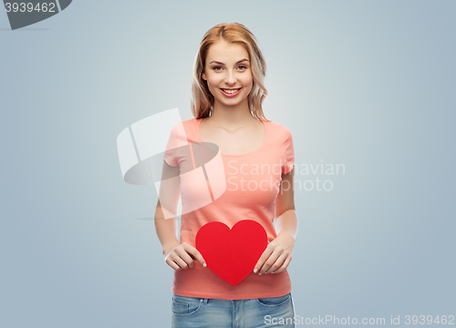 Image of happy woman or teen girl with red heart shape