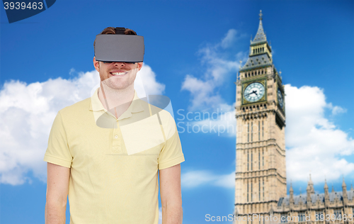 Image of happy man in virtual reality headset or 3d glasses