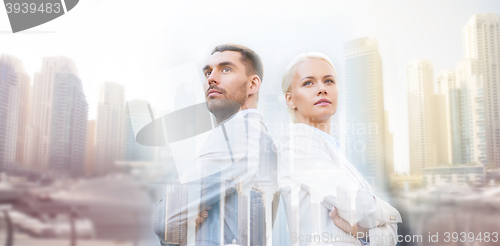 Image of businessman and businesswoman outdoors