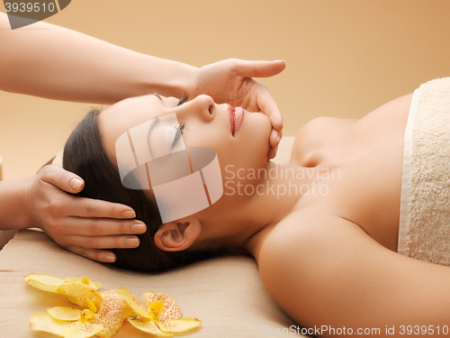 Image of beautiful woman in massage salon