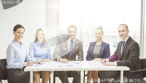 Image of smiling business team at meeting