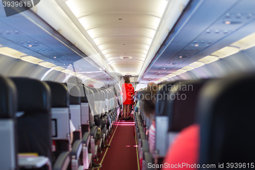 Image of Stewardess on the airplane.