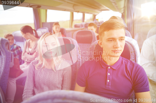 Image of couple or passengers in travel bus