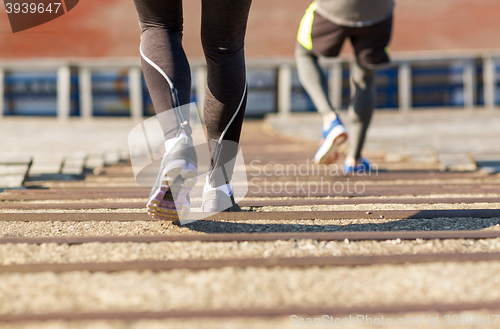 Image of close up of couple running downstairs on stadium