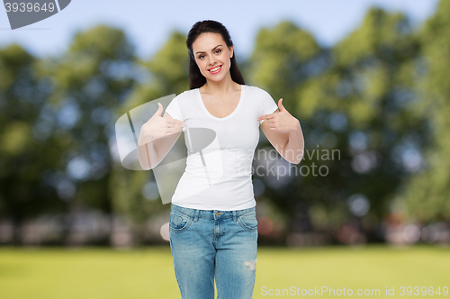 Image of happy young woman or teenage girl in white t-shirt