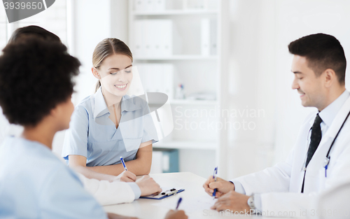 Image of group of happy doctors meeting at hospital office