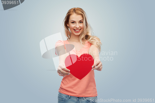 Image of happy woman or teen girl with red heart shape