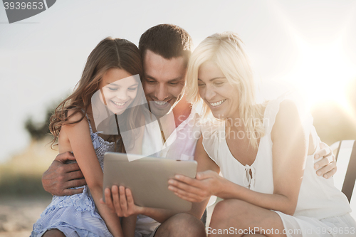 Image of happy family with tablet pc taking picture