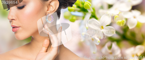 Image of close up of beautiful woman face with earring