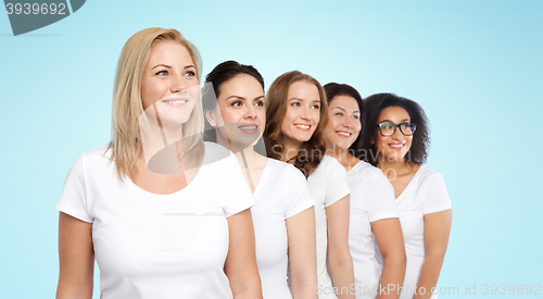 Image of group of happy different women in white t-shirts