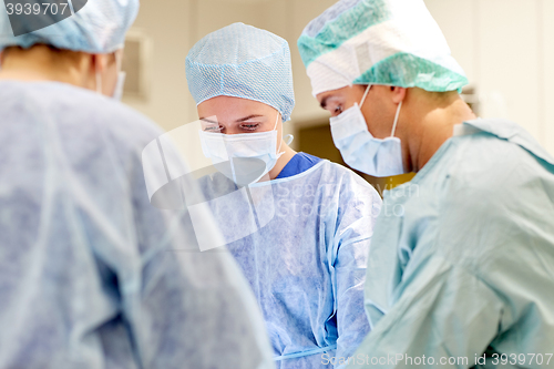 Image of group of surgeons in operating room at hospital