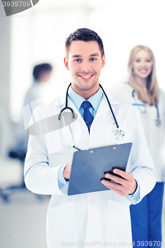 Image of male doctor writing prescription
