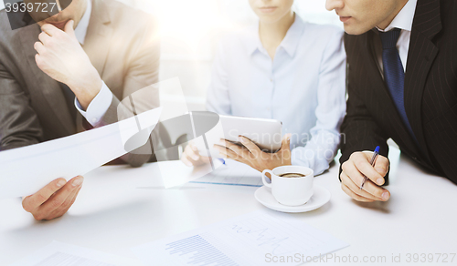 Image of business team with graph, tablet pc and coffee