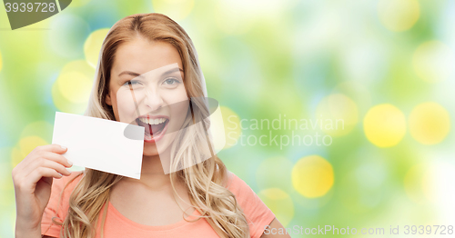 Image of happy woman or teen girl with blank white paper