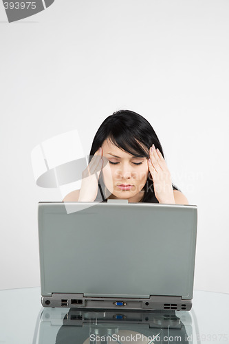 Image of Stressed businesswoman