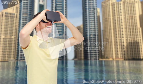 Image of happy man in virtual reality headset or 3d glasses