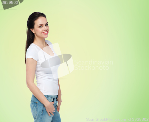 Image of happy young woman or teenage girl in white t-shirt