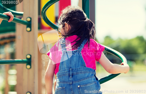 Image of close up of girl climbing on children playground