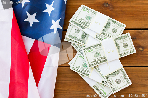 Image of close up of american flag and dollar cash money