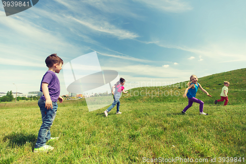 Image of group of happy kids running outdoors