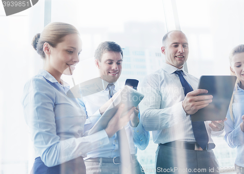 Image of business people with tablet pc and smartphones