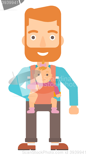 Image of Man holding baby in sling.