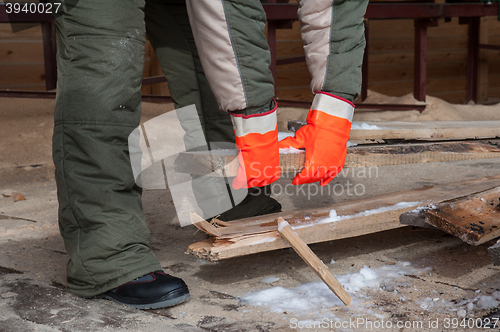 Image of Carpenter working at sawmill 