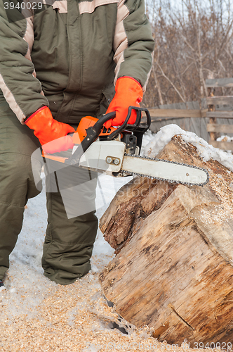 Image of Carpenter working at sawmill 