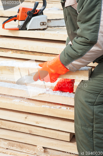 Image of Carpenter working at sawmill 