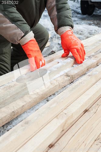 Image of Carpenter working at sawmill 